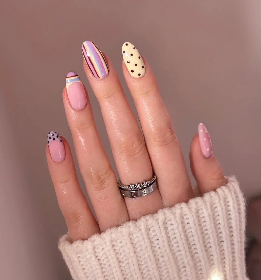 July nail colours ideas 2026 Soft Pink Mix With Dots And Pastel Stripes
