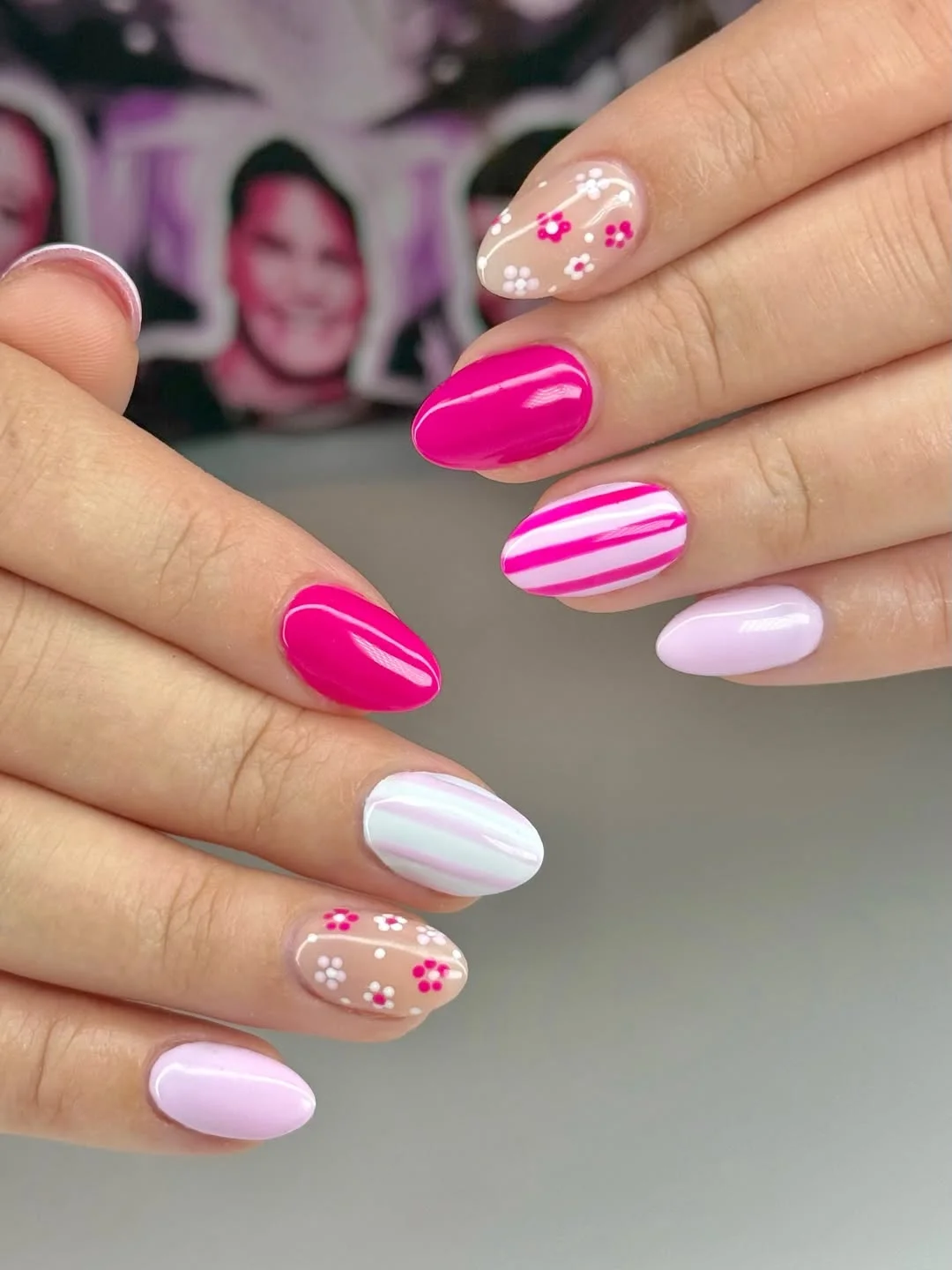 July nail colours ideas 2026 Hot Pink Florals With Sweet Striped Accents