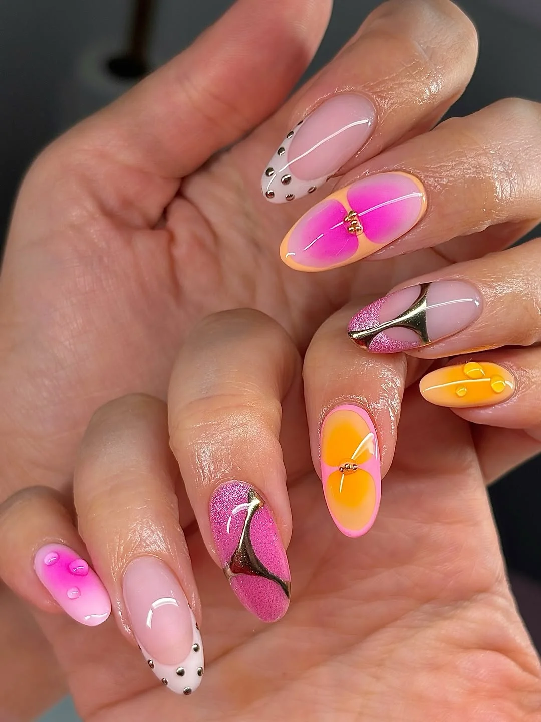 July nail colours ideas 2026 Pink And Mango Almond Nails With Metallic Details