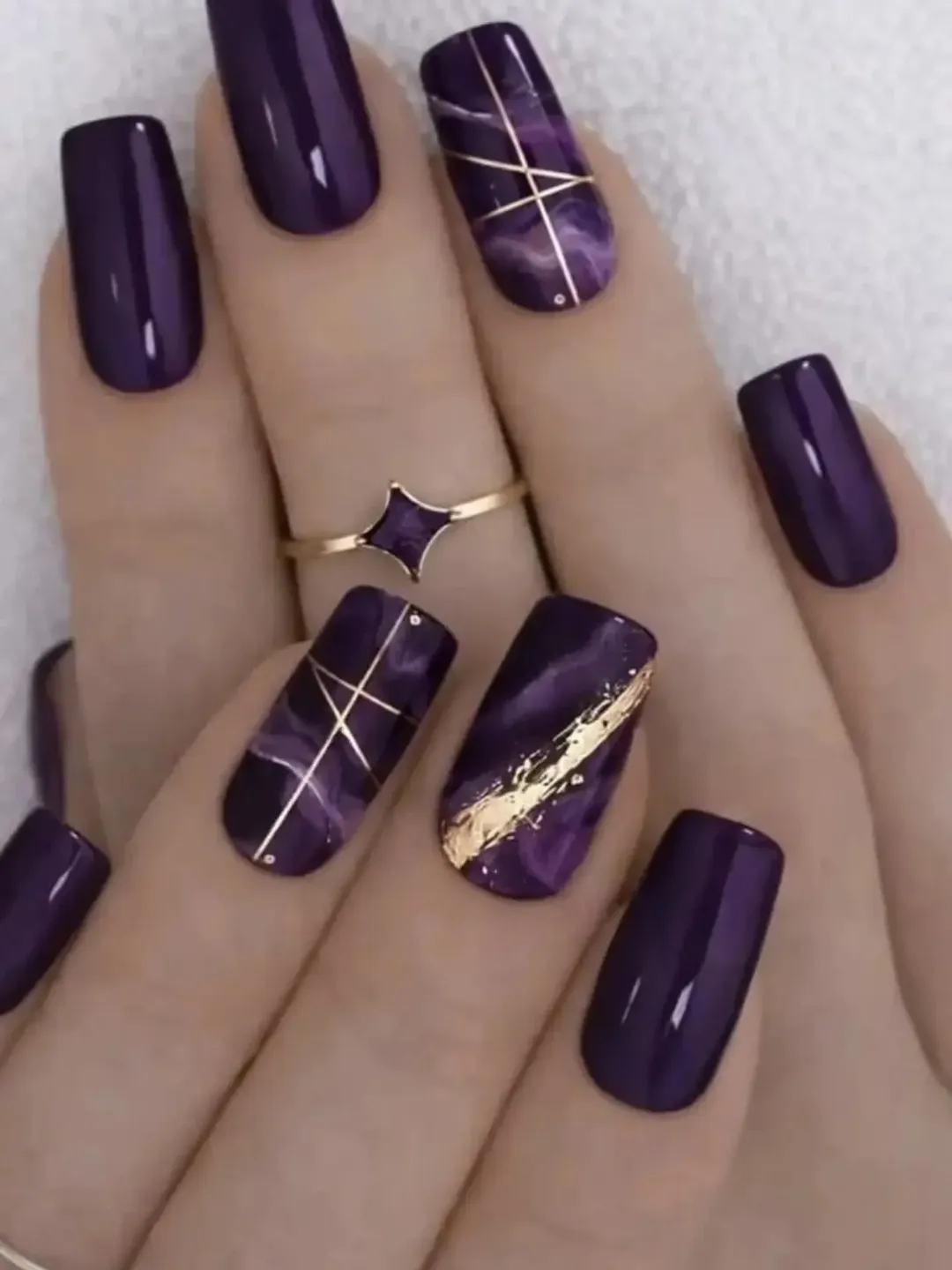 july nails design ideas 2026 + Deep Purple Marble Nails With Gold Linework