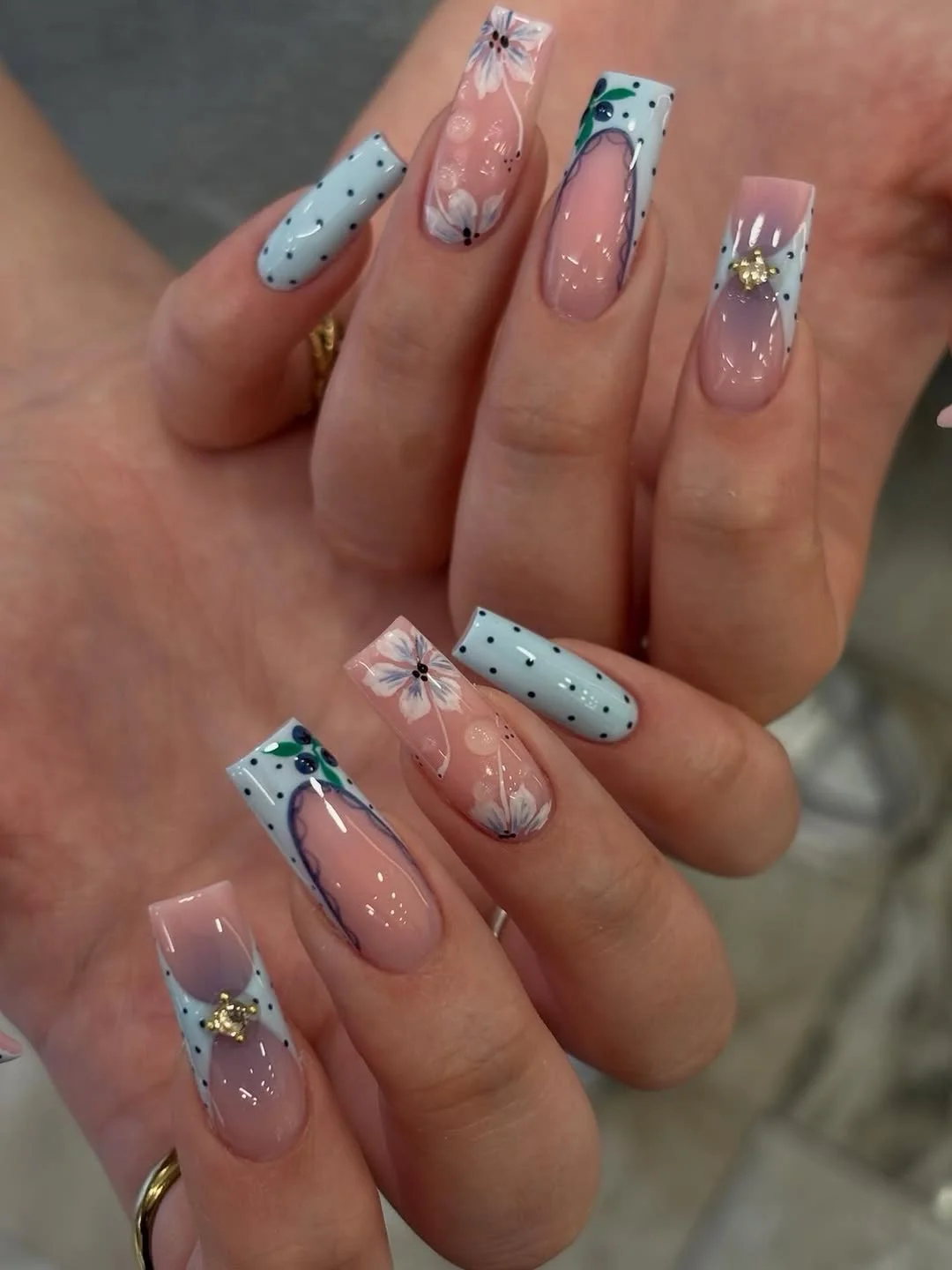 july nails design ideas 2026 + Blue Floral Coffin Nails With Dotted Garden Details