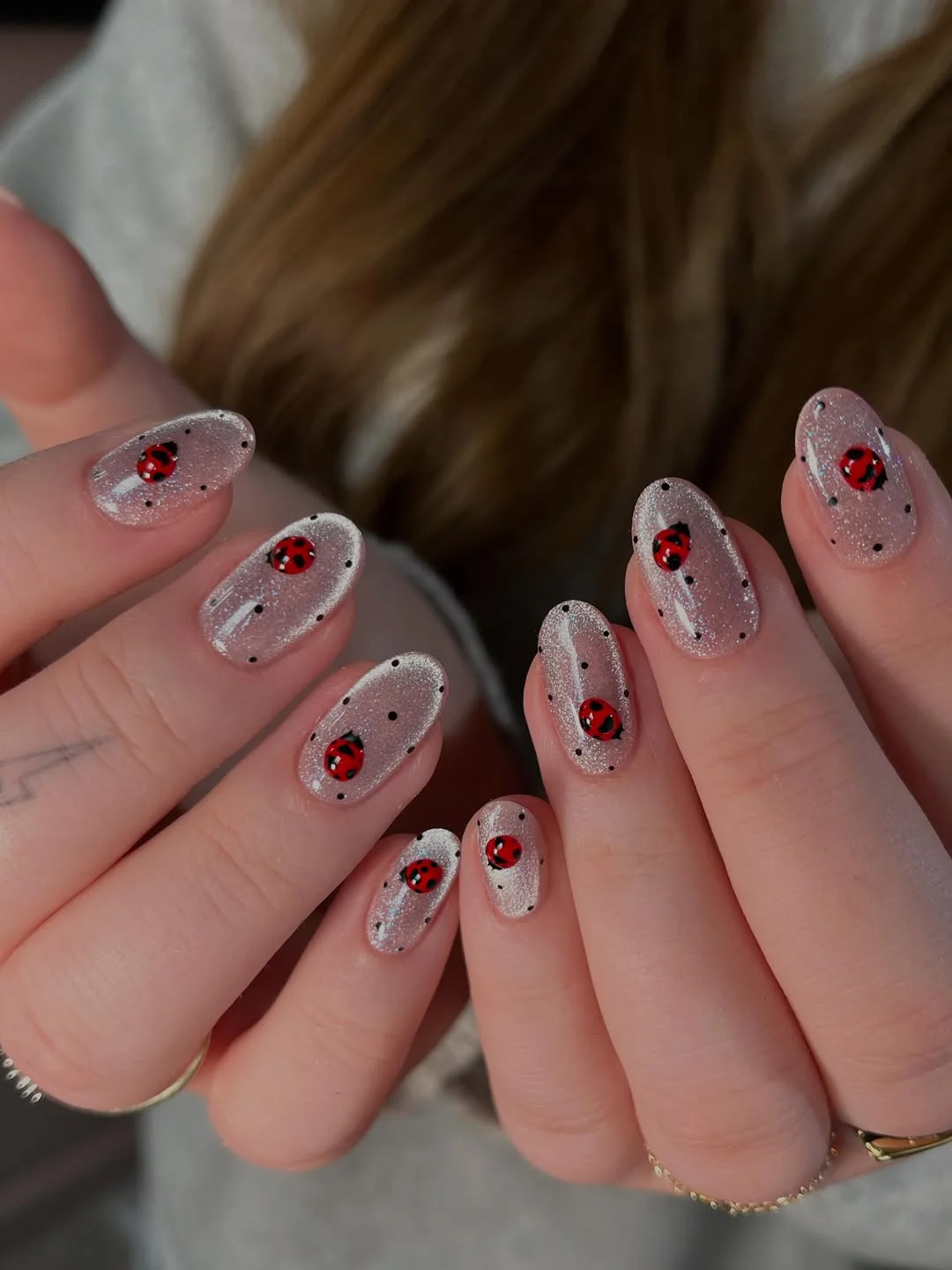 july nails design ideas 2026 + Silver Ladybug Nails With Tiny Black Dots