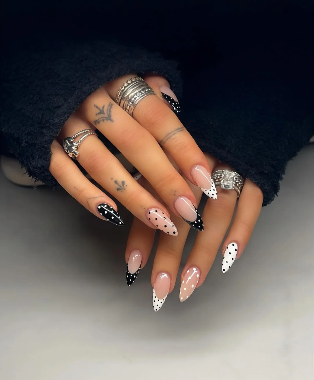 july nails design ideas 2026 + Monochrome Polka Dot Almond Nails With a Fashion Edge