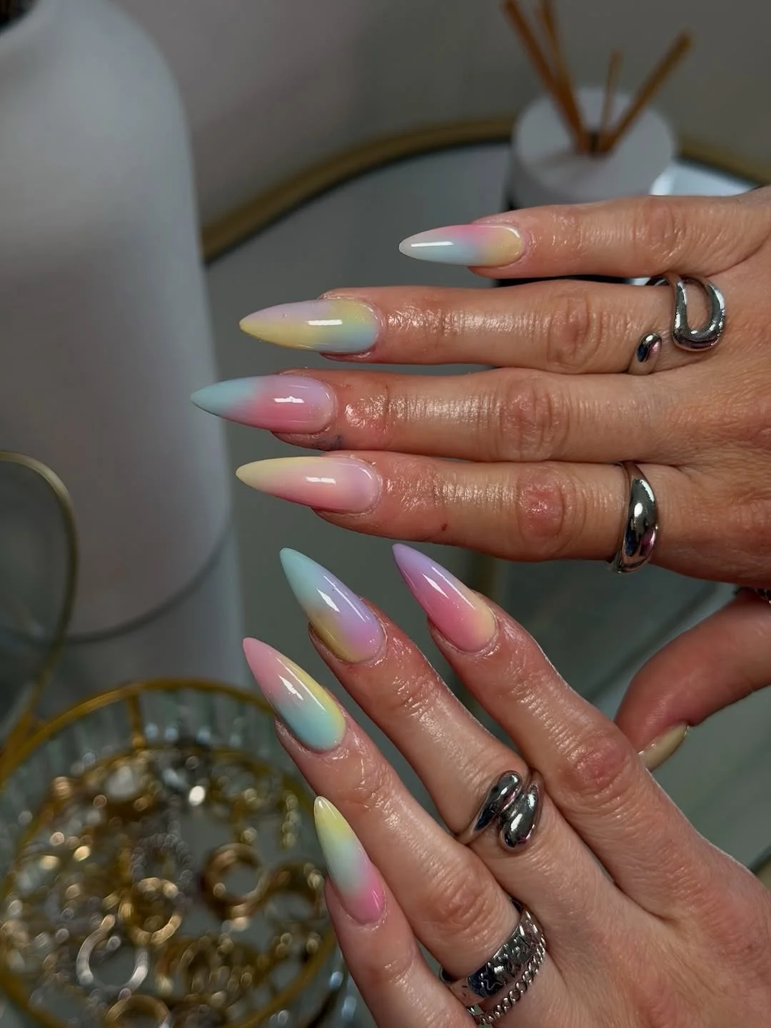 july nails design ideas 2026 + Pastel Ombre Stiletto Nails With a Candy-Sky Finish