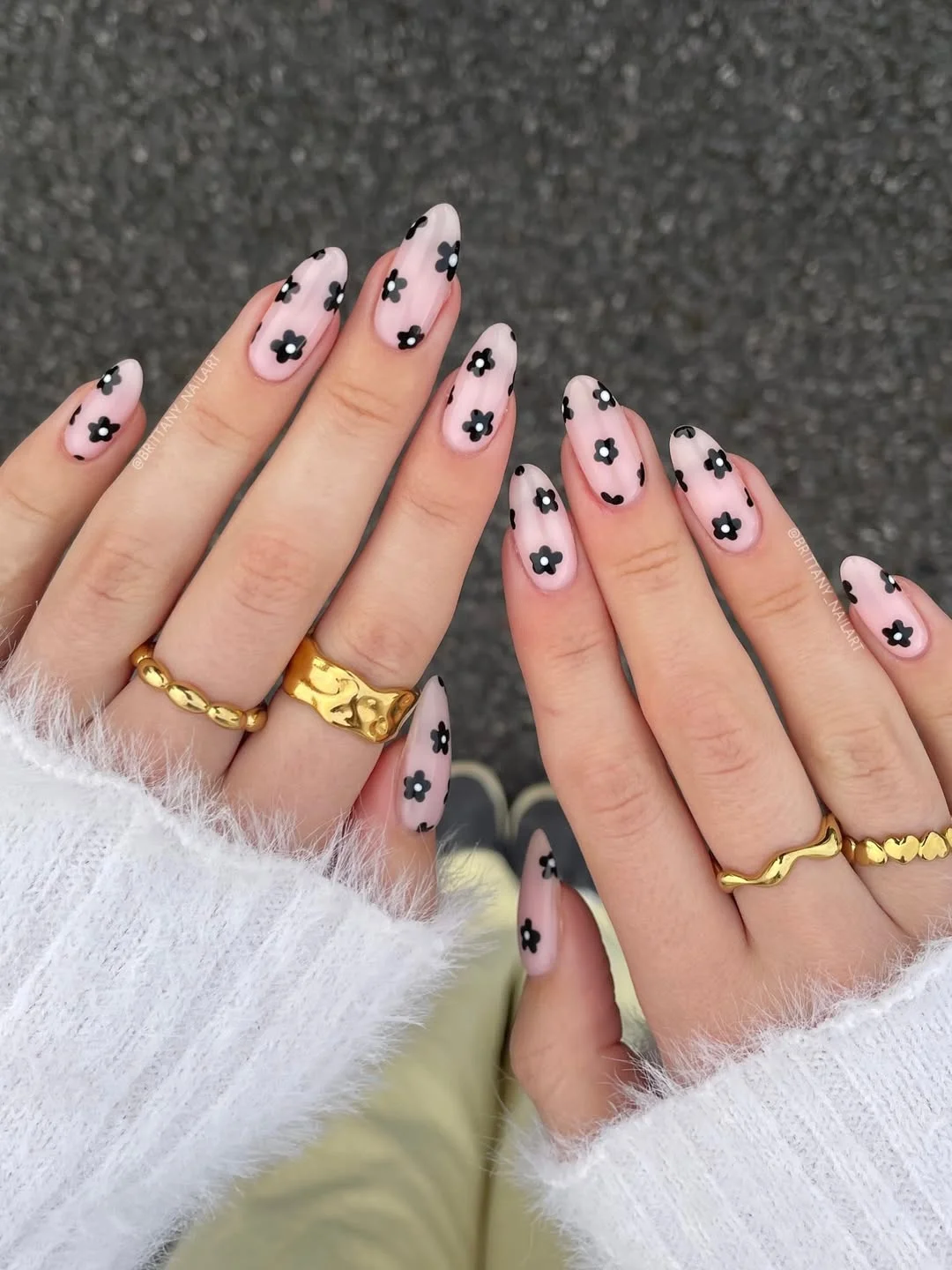 july nails design ideas 2026 + Sheer Black Daisy Nails for a Chic July Contrast