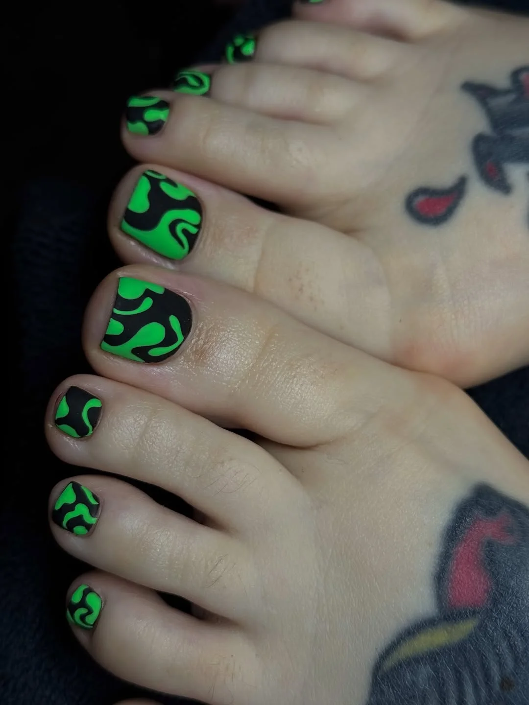 July toe nail colours ideas 2026 Neon Green Swirls With A Black Graphic Base