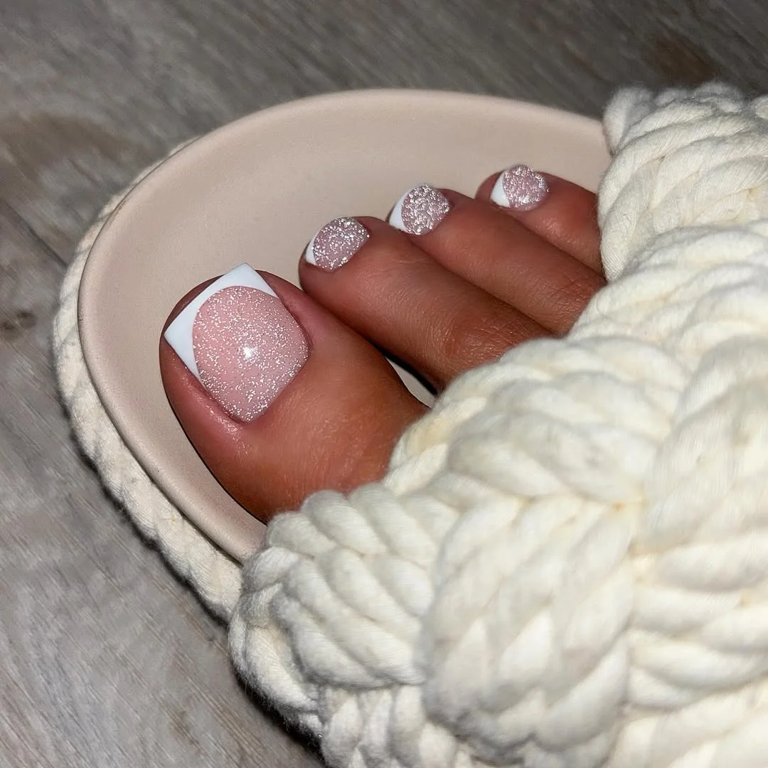 July toe nails design - summer ideas 2026 + Glitter French Toe Tips With A Soft White Sandal