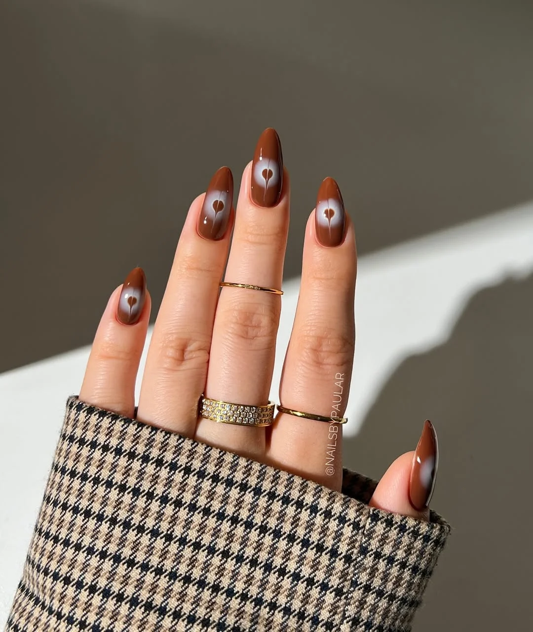 June manicure ideas 2026 Caramel Brown Aura Nails with Tiny Heart Centers