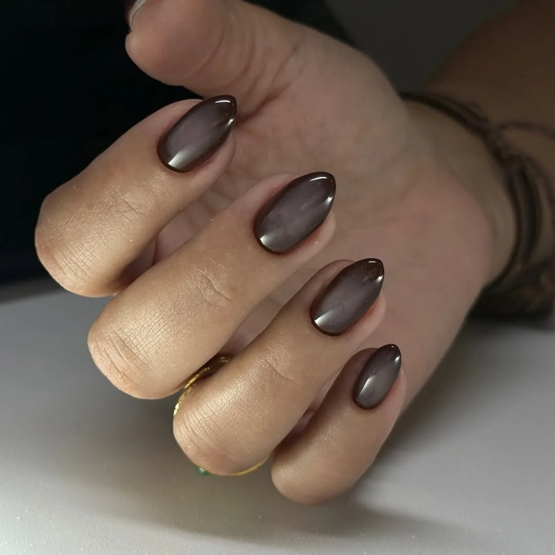 June manicure ideas 2026 Smoky Taupe Cat Eye Almond Nails