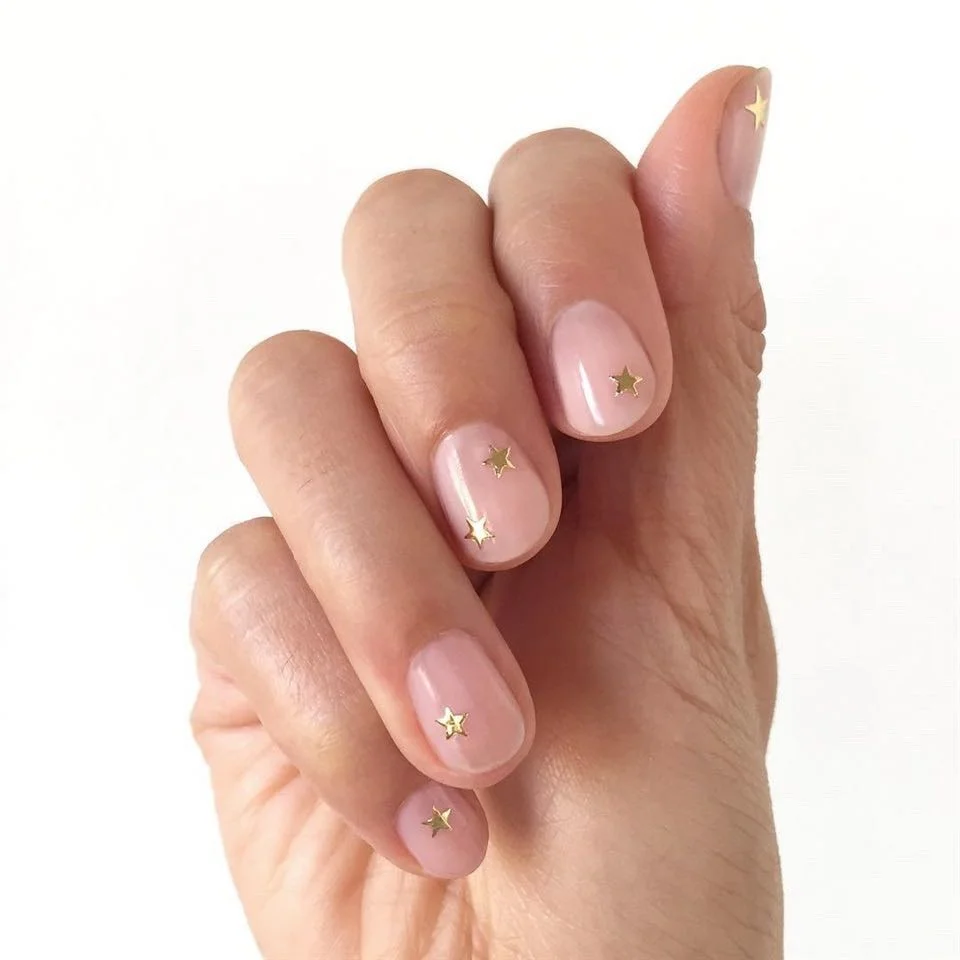 June manicure ideas 2026 Tiny Gold Stars on Blush Short Nails