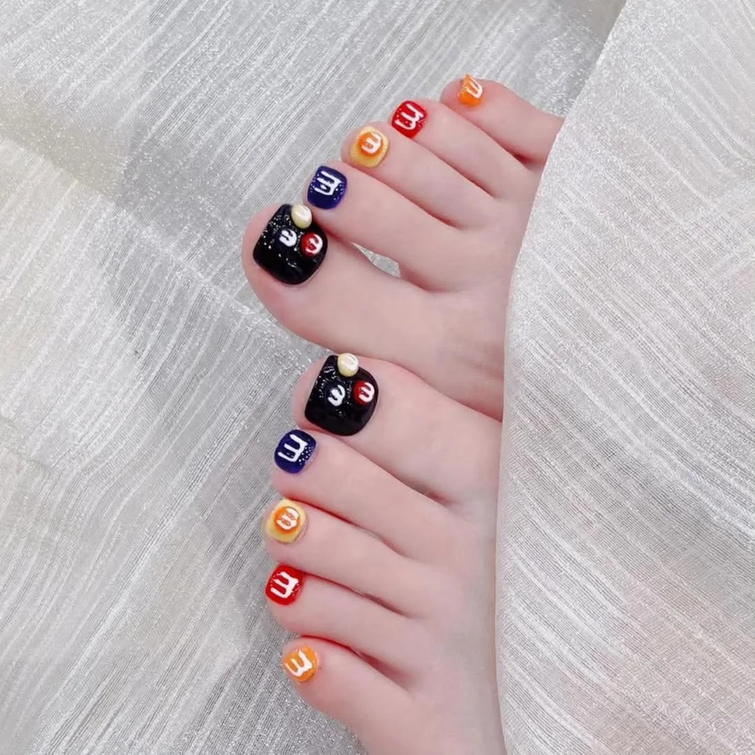 June pedicure ideas 2026 + Candy Colored Pedicure With Playful Letter Art