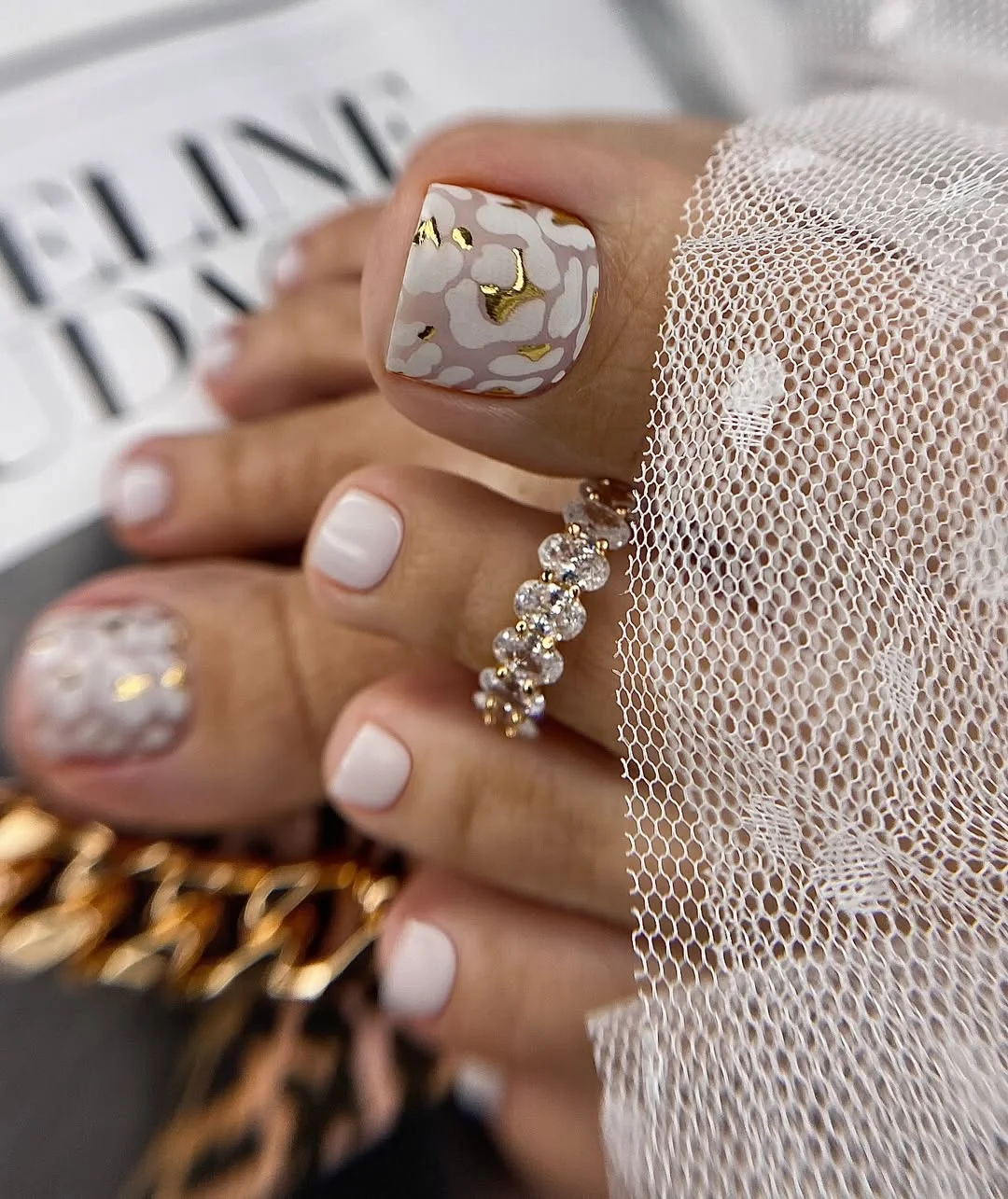 June pedicure ideas 2026 + Milky White Floral Pedicure With Gold Details