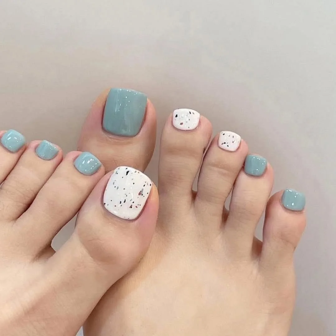 June pedicure ideas 2026 + Dusty Blue Pedicure With Speckled White Accents