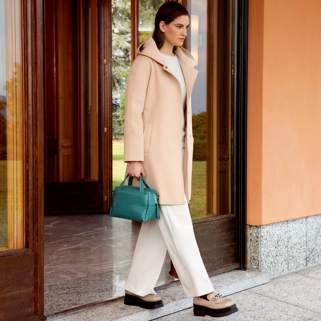 new trends fall fashion 2026 Pale Coat and Teal Bag for a Polished Fall Walk