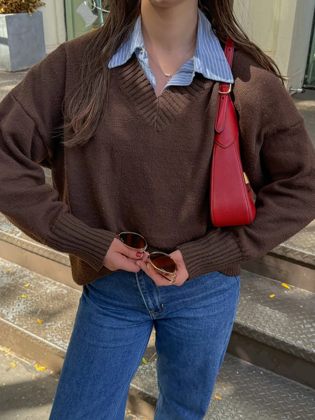 new trends fall fashion 2026 + Chocolate V-Neck Knit with a Striped Shirt and Red Bag