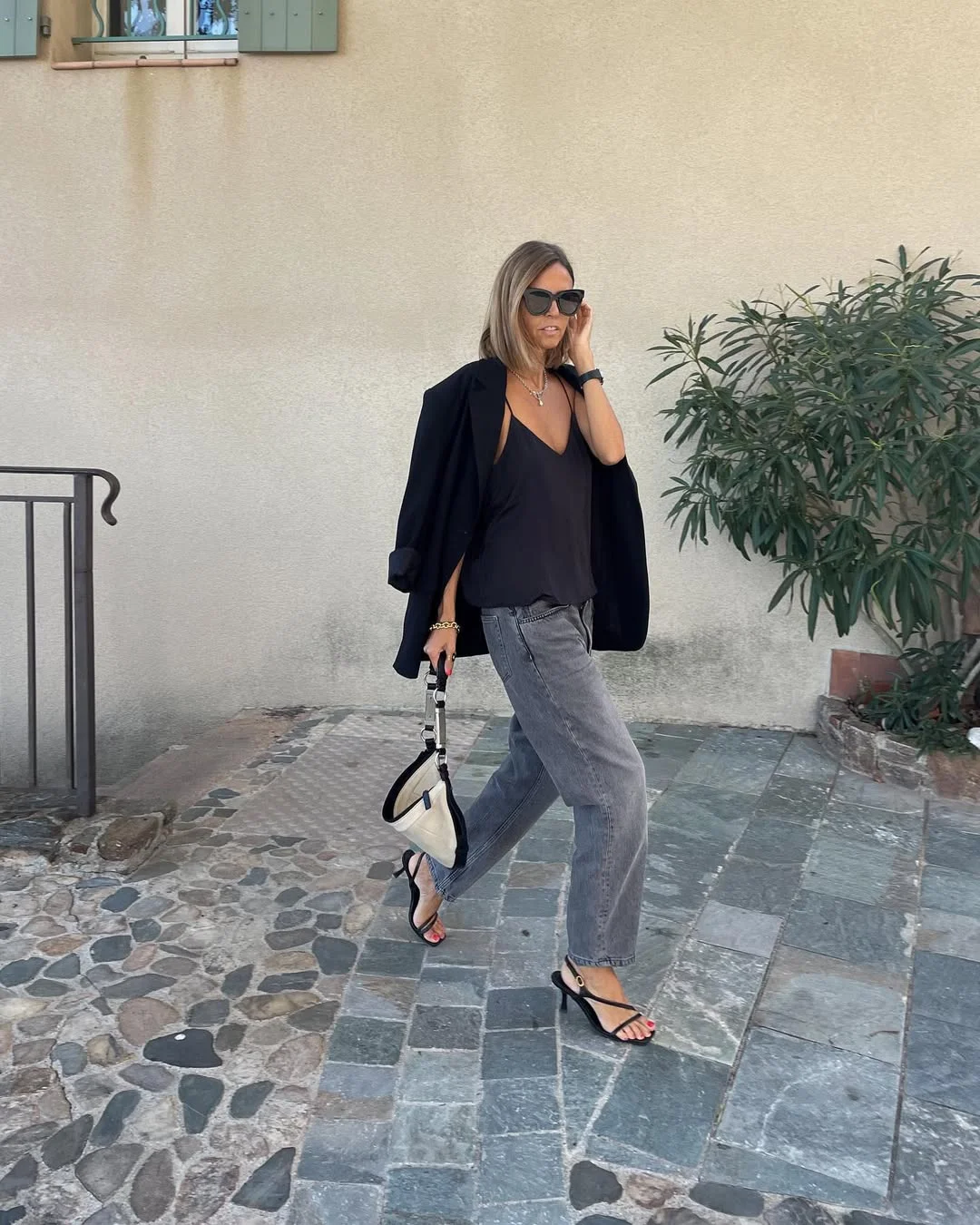 simpl fall outfits 2026 Black Camisole and Gray Jeans for a Warm Fall Evening
