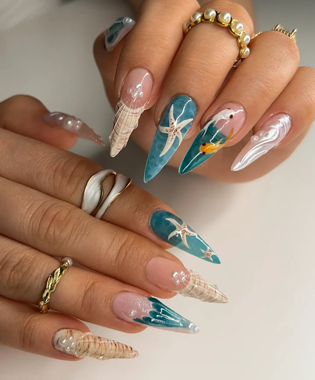 starfish summer nails 2026 + Teal Ocean Stiletto Nails with Seashell Texture
