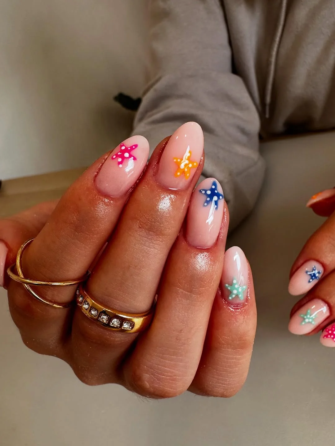 starfish summer nails 2026 + Colorful Almond Starfish on Glossy Nude Nails