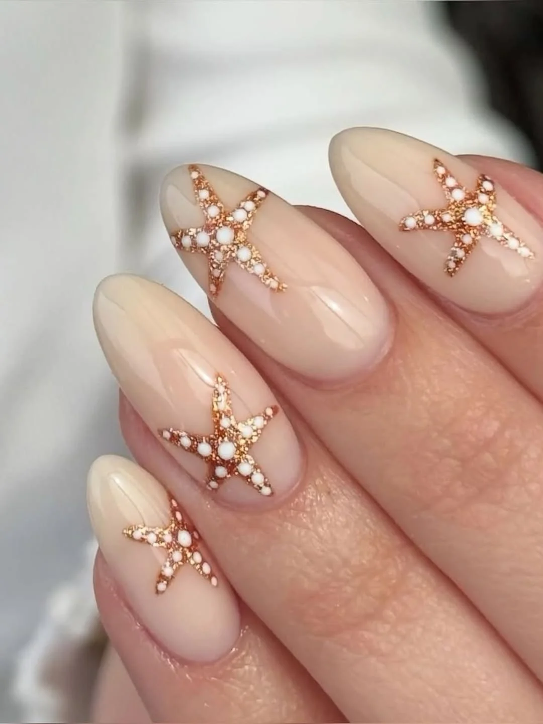 starfish summer nails 2026 + Champagne Almond Nails with Textured Gold Starfish