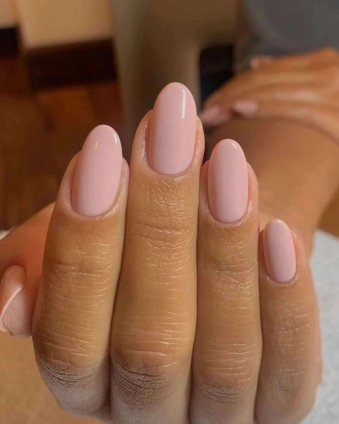 summer oval nails 2026 Glossy Baby Pink Oval Nails on Warm Skin