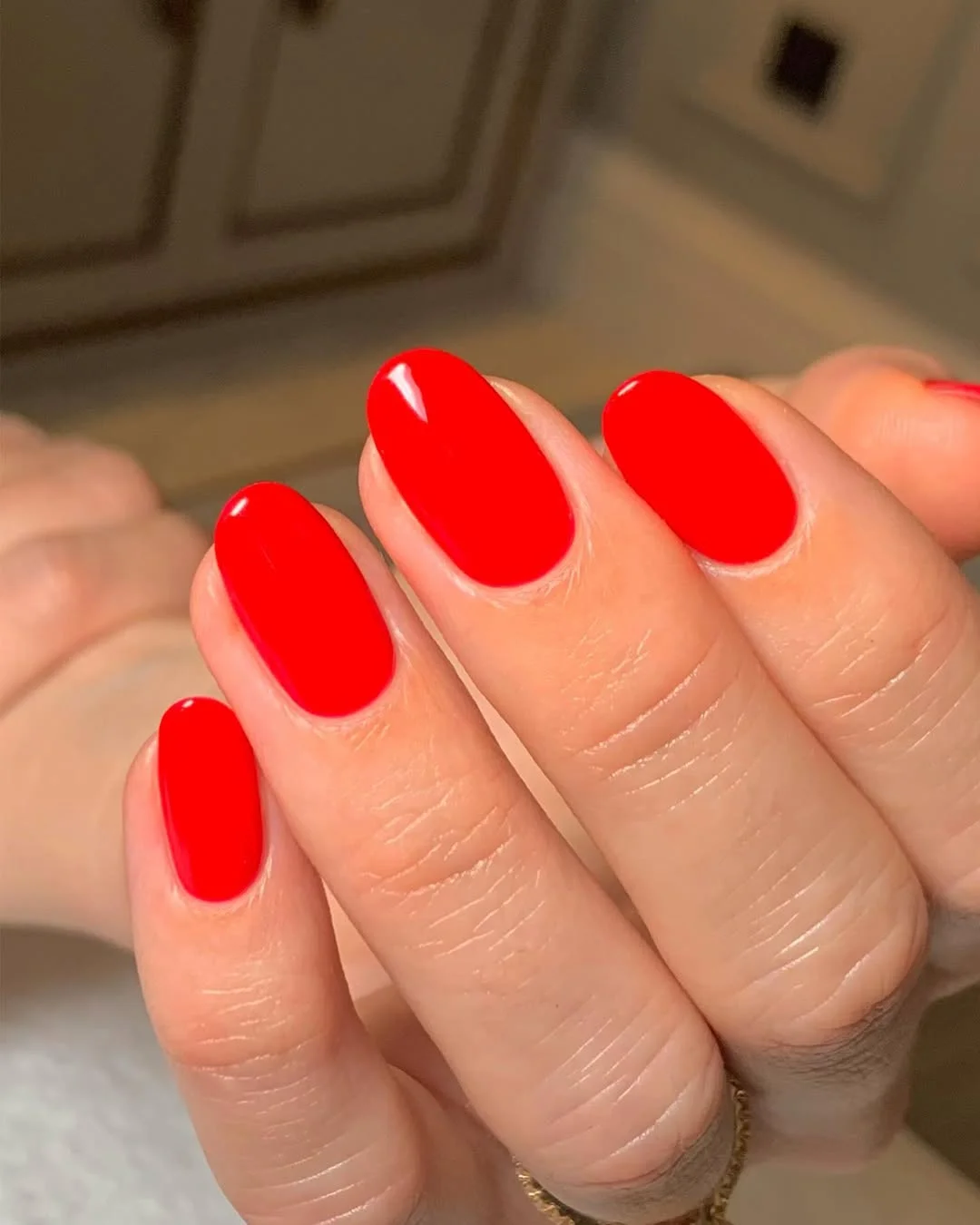 summer oval nails 2026 Bright Red Oval Nails With a High-Gloss Finish