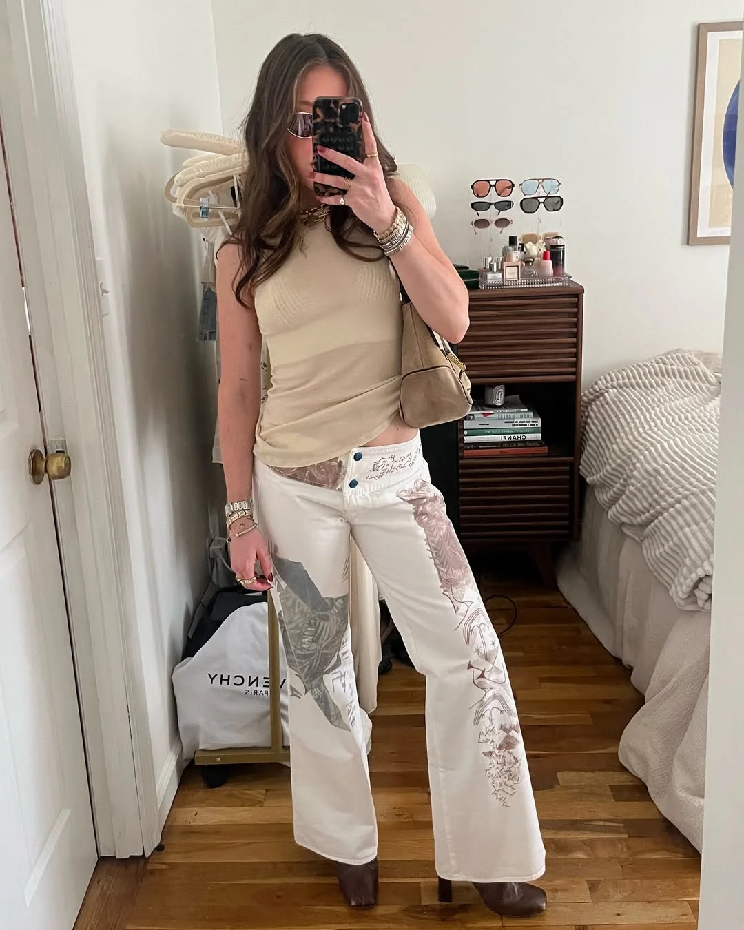 Summer to fall outfits 2026 Cream Tank With Printed White Denim and Brown Boots
