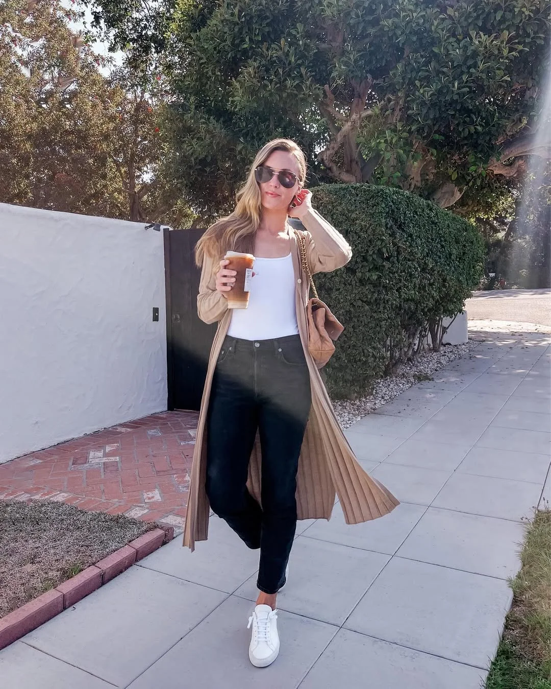 Summer to fall outfits 2026 Long Beige Cardigan With Black Jeans and White Sneakers