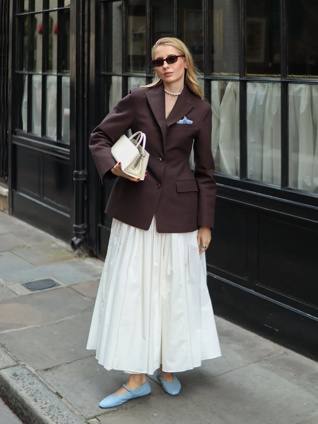 Trendy blazer outfits - fall 2026 + Brown Blazer With A Flowing White Skirt And Soft Blue Flats