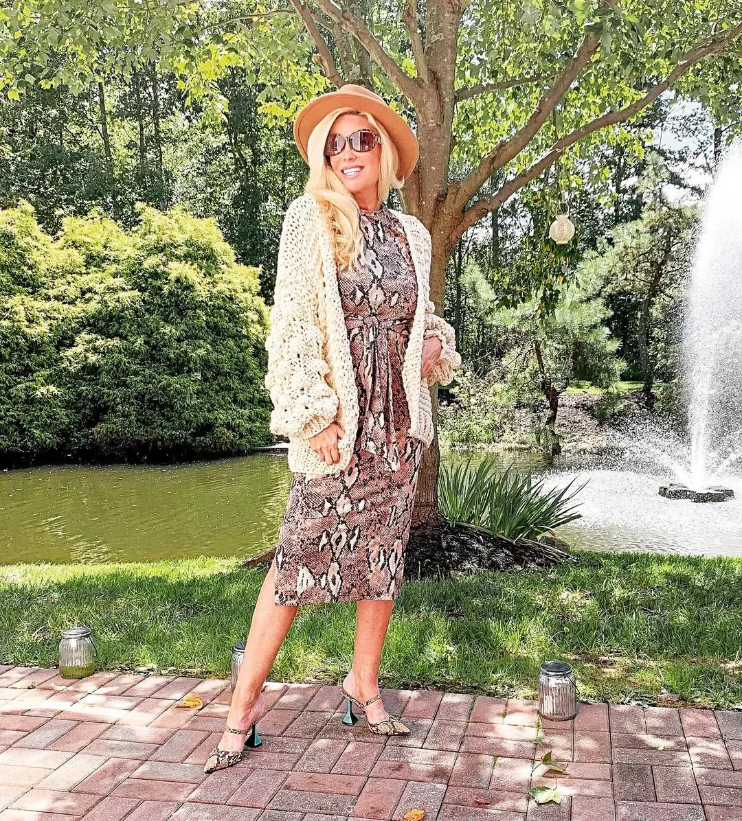 what to wear in fall 2026 over 50 Snake Print Midi Dress With a Chunky Cream Cardigan