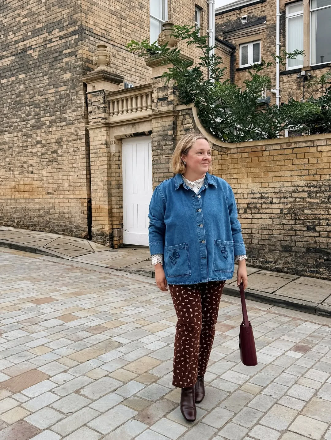 what to wear in fall 2026 over 50 Denim Chore Jacket With Floral Brown Trousers