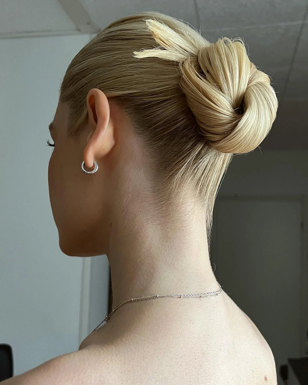 august hairstyles and color ideas 2026 + Sleek Blonde Knot for a Minimal Evening Look