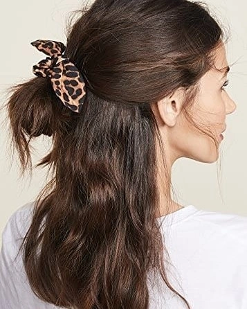 august hairstyles and color ideas 2026 + Leopard Bow Half-Up Hair With Loose Waves