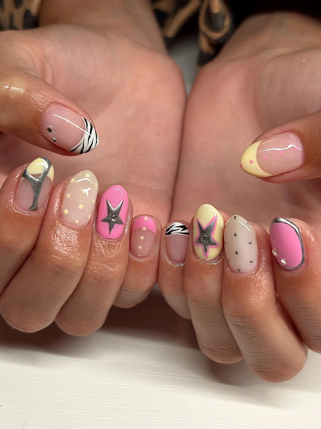 august nails ideas 2026 + Y2K Pop Art Nails With Chrome Stars and Zebra Tips