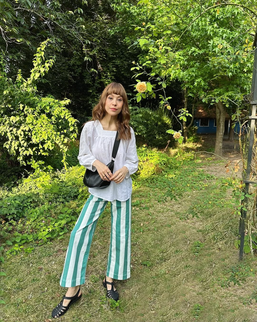 august outfits 2026 + White Blouse and Green Stripe Pants for an Artistic August Afternoon