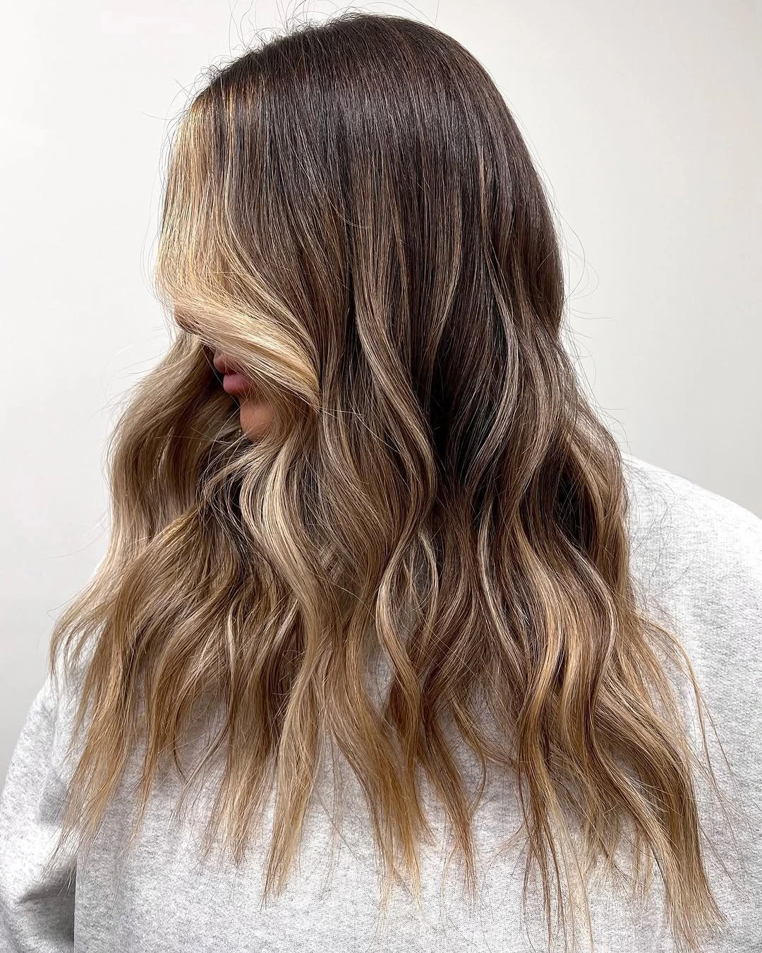 babylights hair ideas Soft Caramel Babylights On Brunette Waves