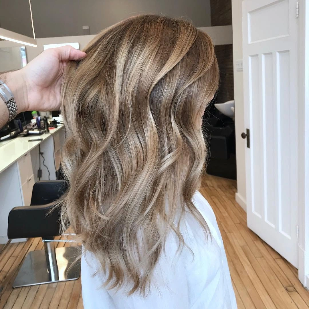babylights hair ideas Sandy Blonde Waves With Natural Depth