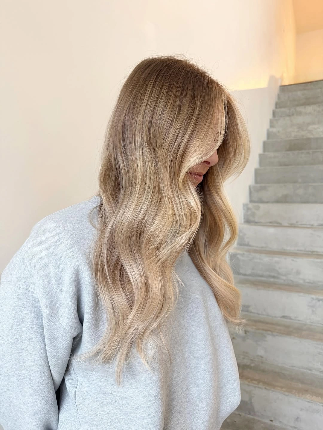 beige blond hair color Sandy Cream Blonde With Soft Waves