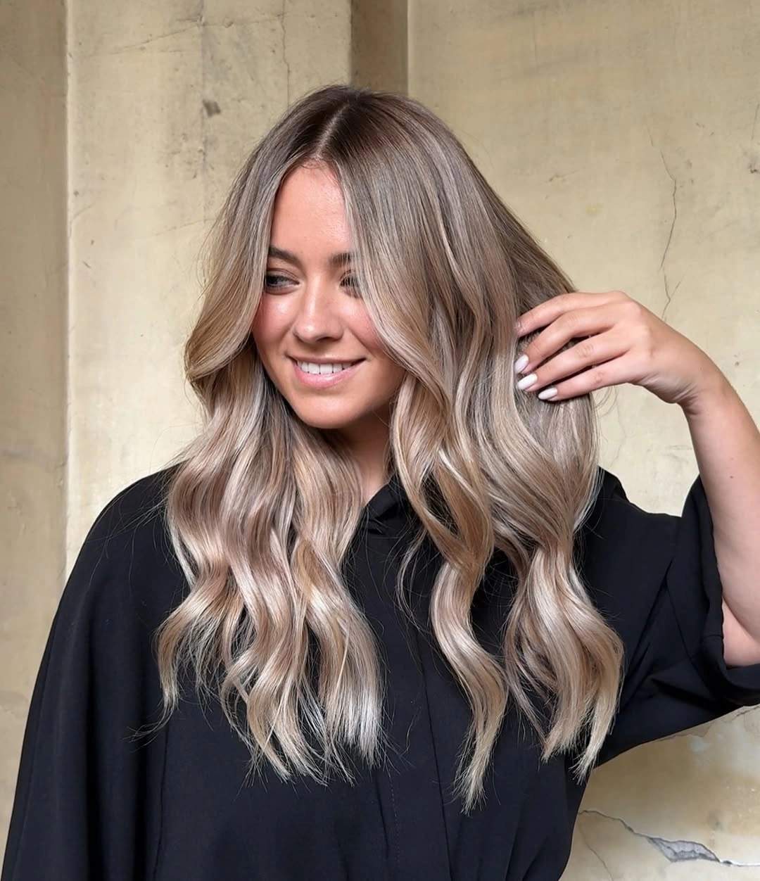 beige blond hair color Cool Beige Waves With Lived-In Roots