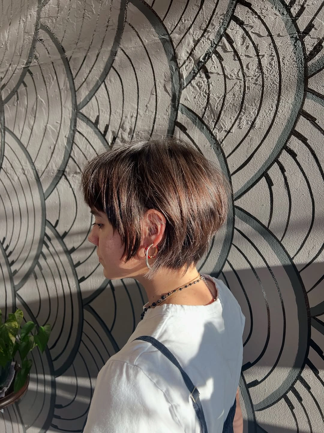 bixie haircut Micro Brunette Bixie With a Pointed Sideburn