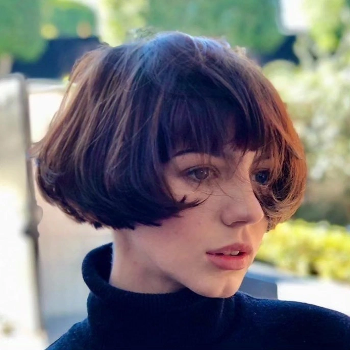 bobbed haircut for women Rounded Vintage Bob With Soft Curtain Bangs