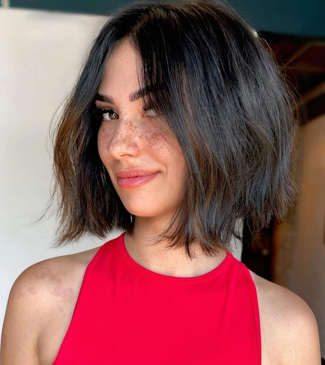 bobbed haircut for women Messy Brunette Bob With A Red Tank Top Moment