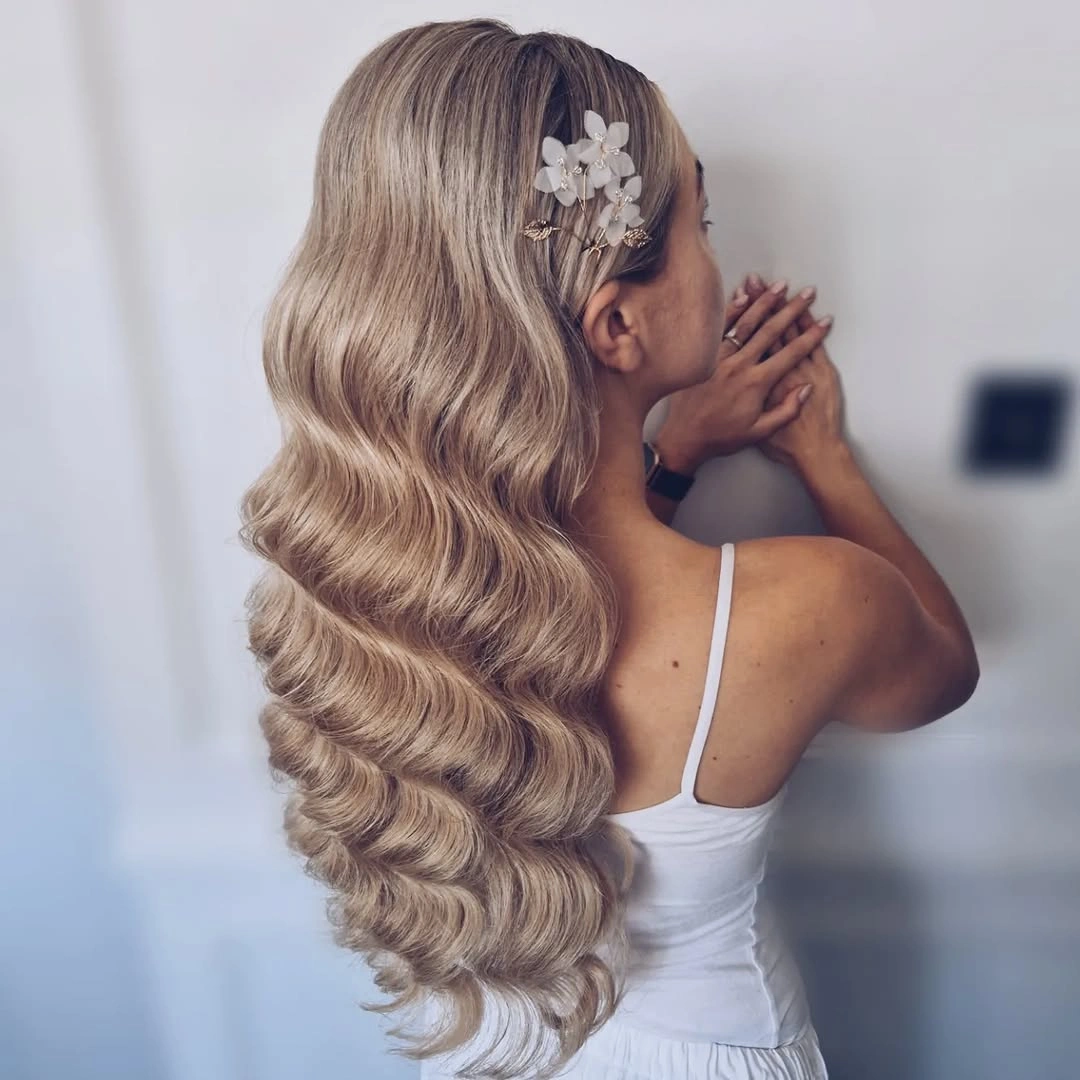 body waves hairstyle Floral Pins Against Icy Sculpted Waves
