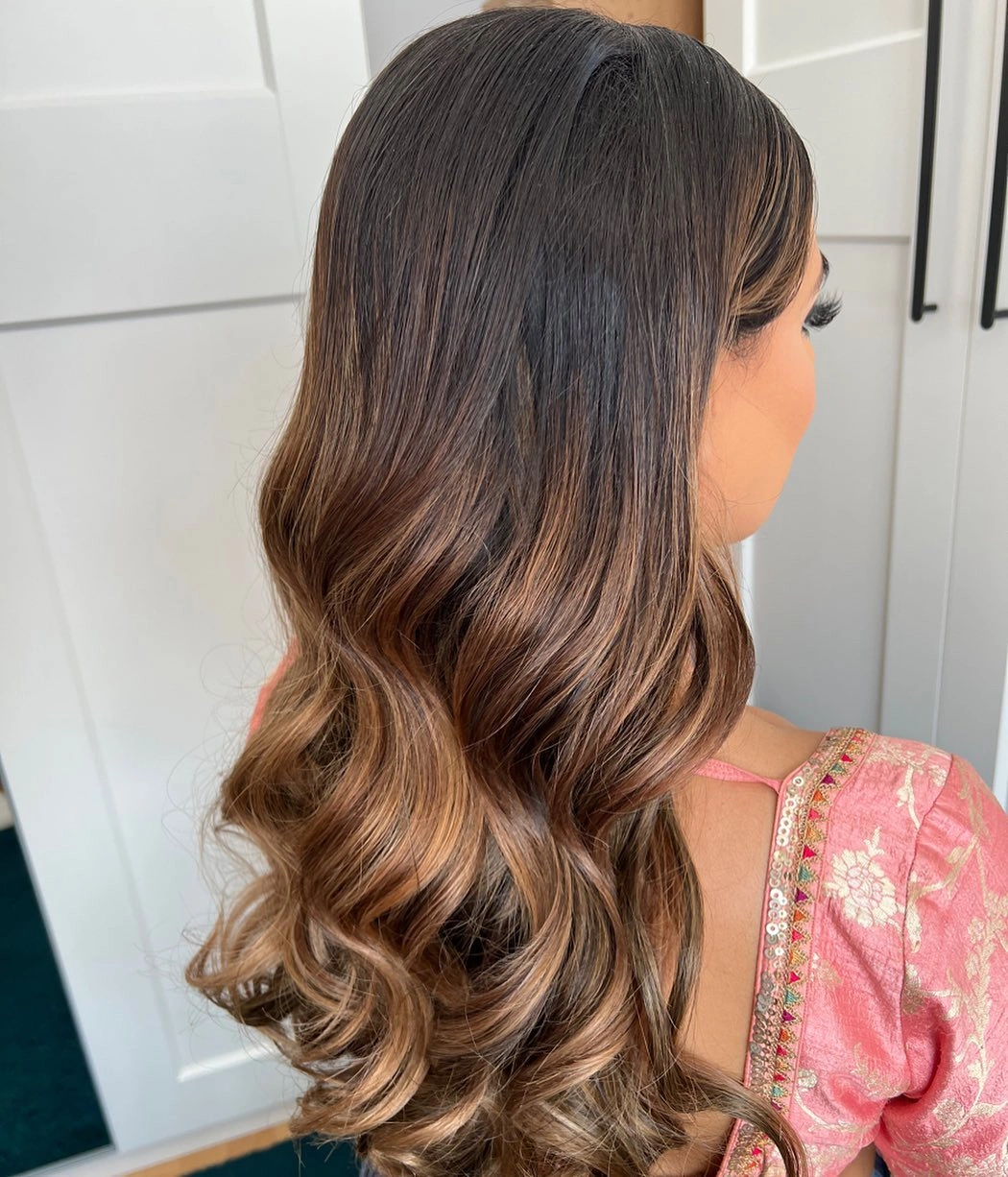 body waves hairstyle Caramel Balayage Woven Through Brunette Waves
