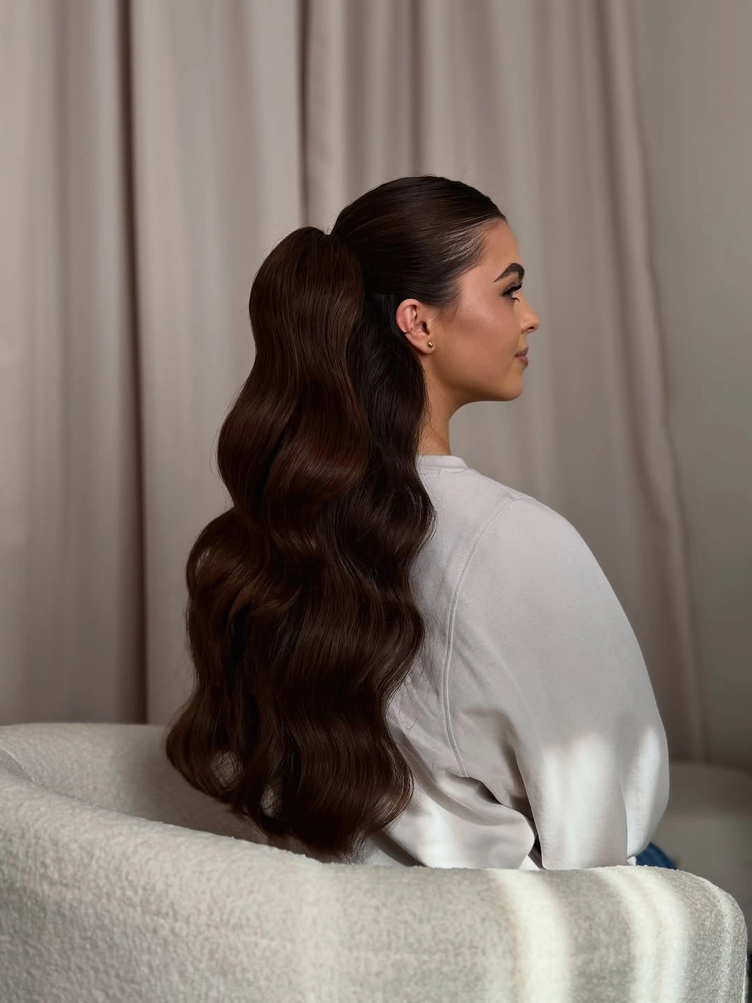 body waves hairstyle High Ponytail With Sculpted Brunette Ripples