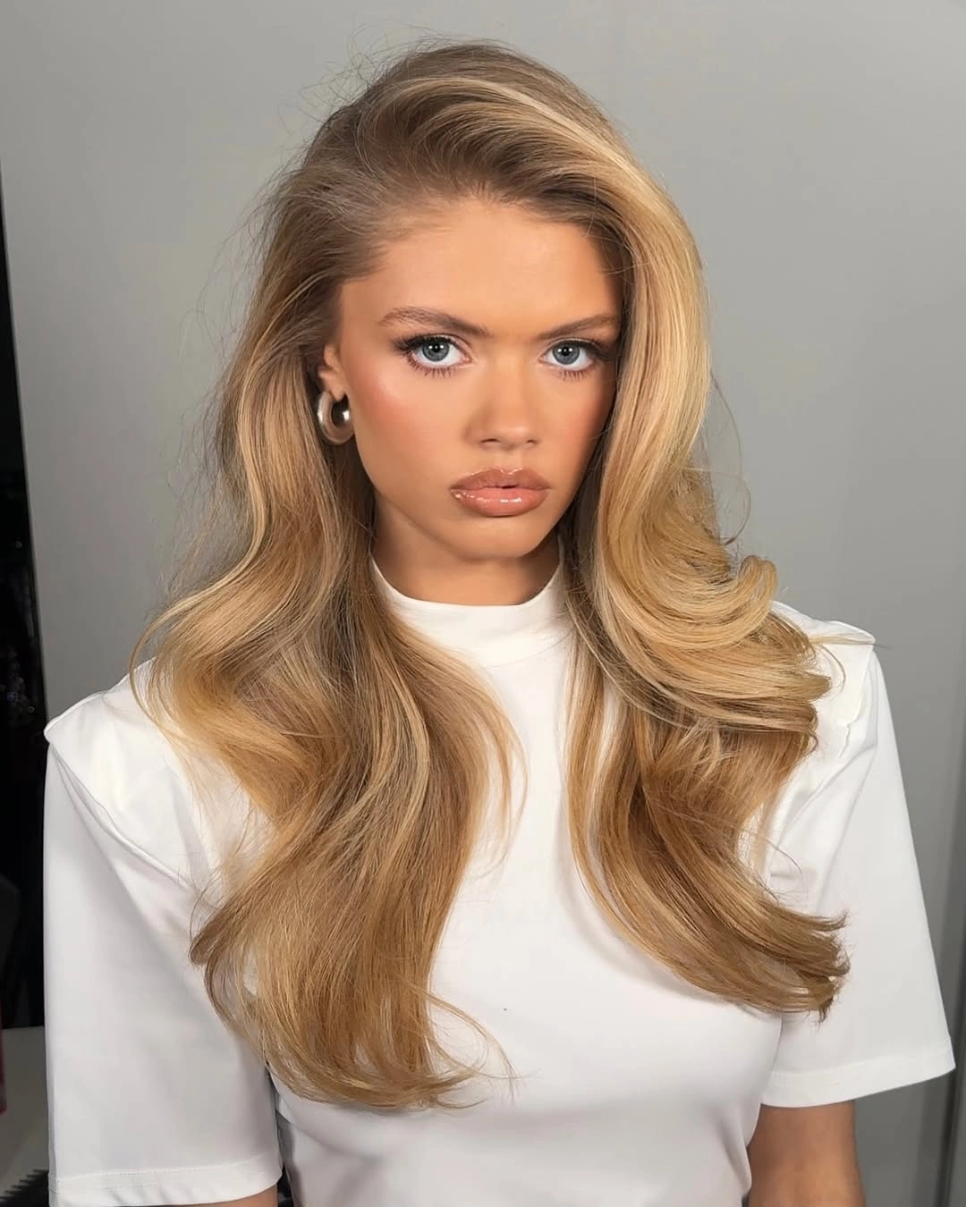 body waves hairstyle Side-Swept Blonde Blowout With Flipped Ends