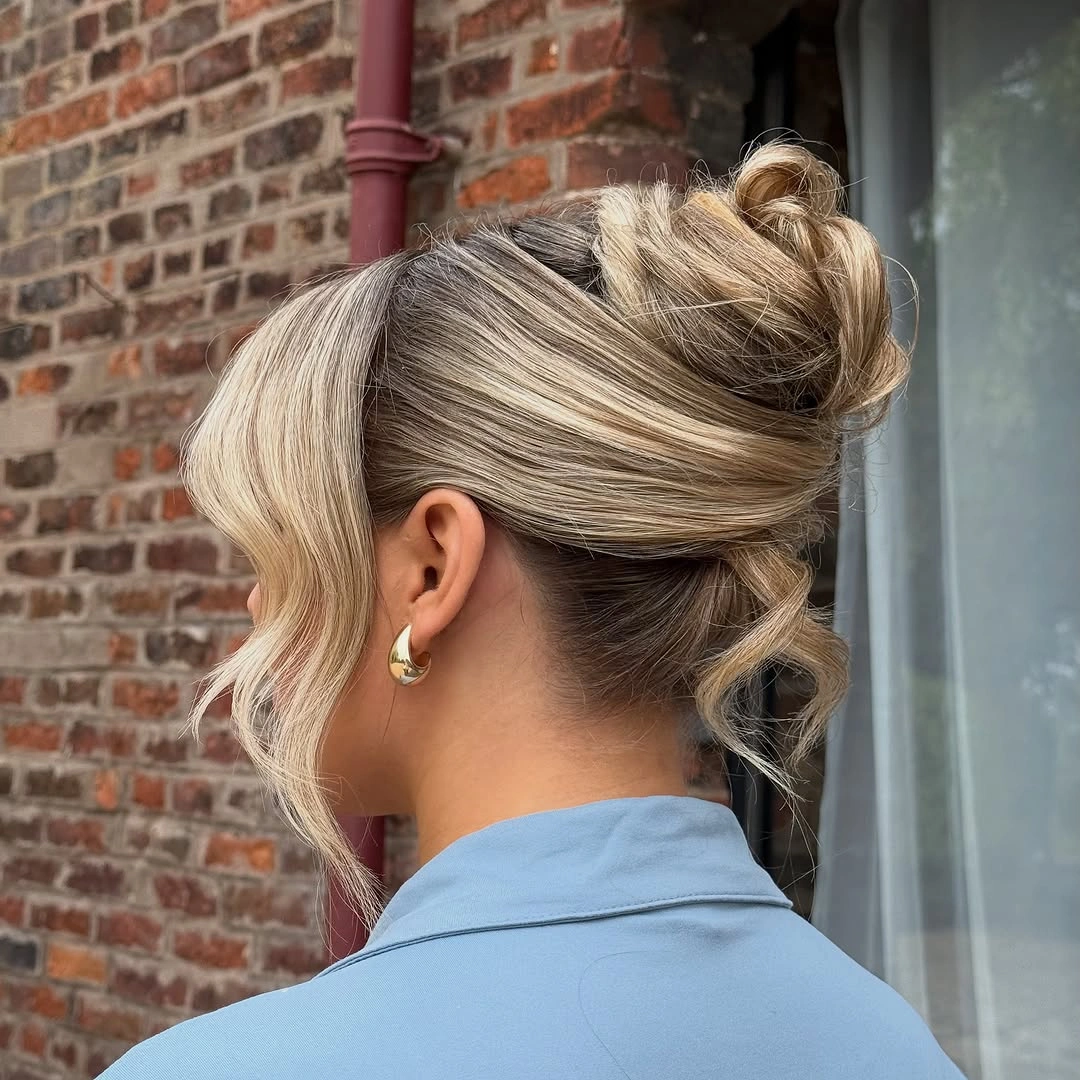 bridesmaid hairstyling French-Twist Bun With Face-Framing Bangs