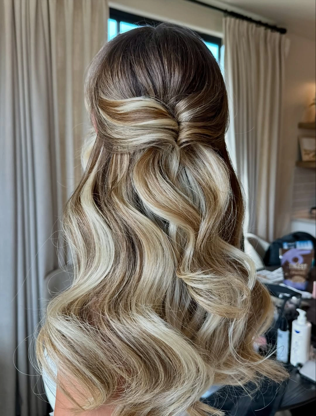bridesmaid hairstyling Dimensional Half-Up Twist With Bouncy Ends