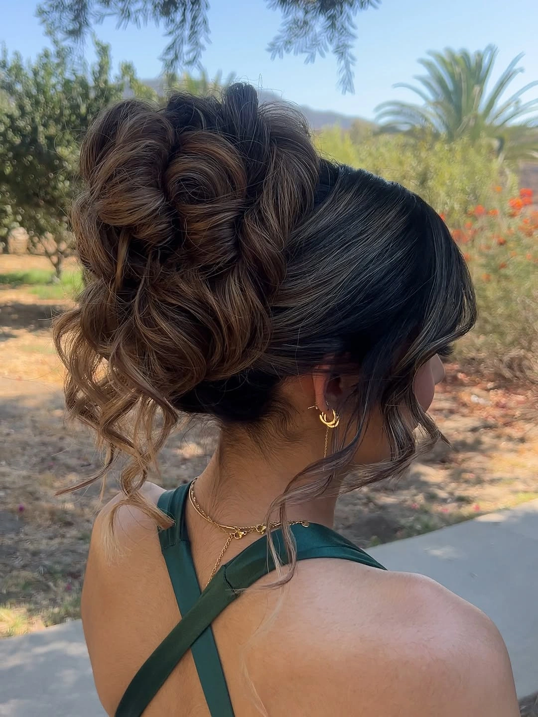 bridesmaid hairstyling High Curly Ponytail With Face-Framing Pieces