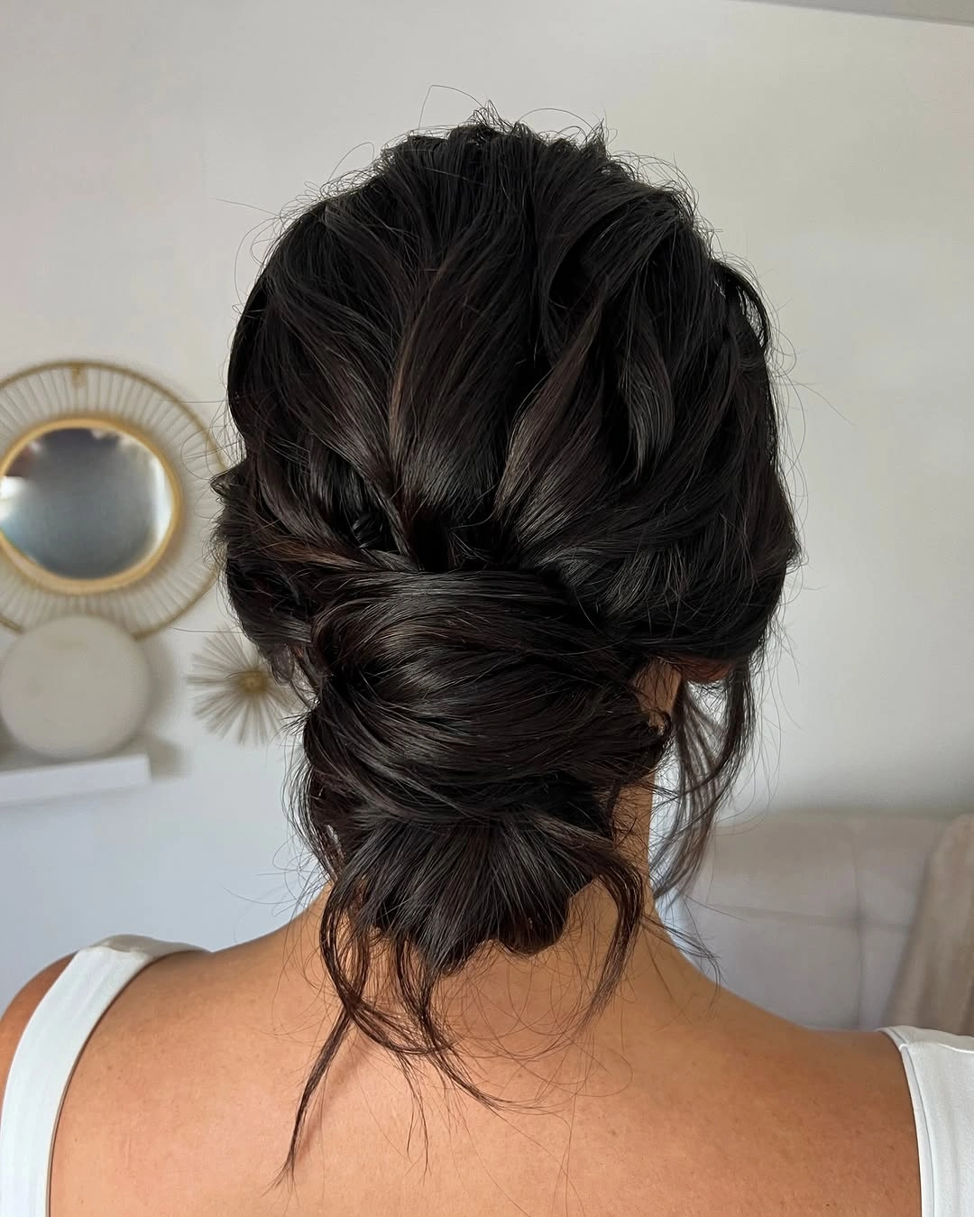 bridesmaid hairstyling Romantic Low Chignon For Glossy Brunettes