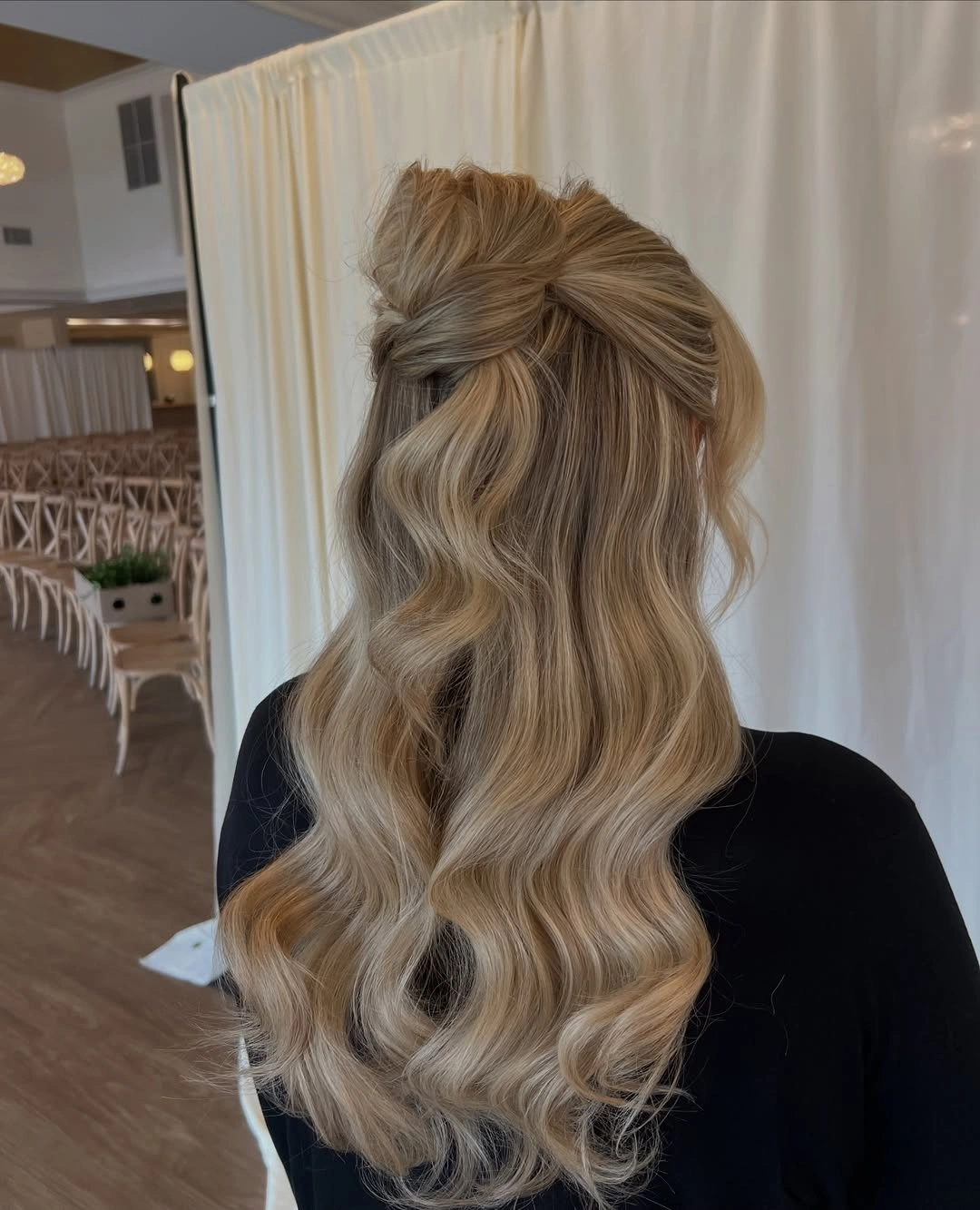 bridesmaid hairstyling Blonde Half-Up Bow Bun With Ceremony Waves